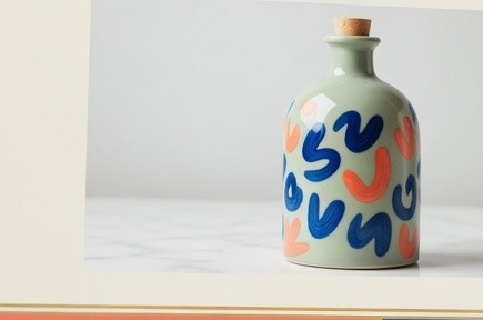 Painted ceramic bottle used as a product photo on a sample sales page